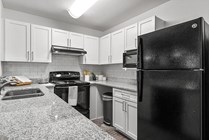 Cabana-Beach-Gainesville-Apartments-Near-University-of-Florida-Kitchen-Black-Appliances