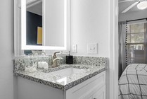 Cabana-Beach-Gainesville-Apartments-Near-University-of-Florida-Private-Bathroom-Granite-Countertop-LED-Bathroom-Mirror